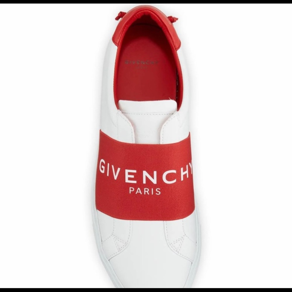 Givenchy women’s low top sneaker with a logo band and foil logo at the heel.